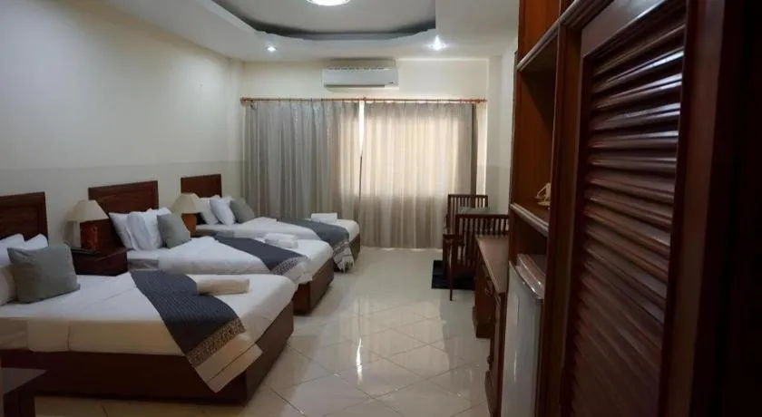 Bed in New Rose Boutique Hotel