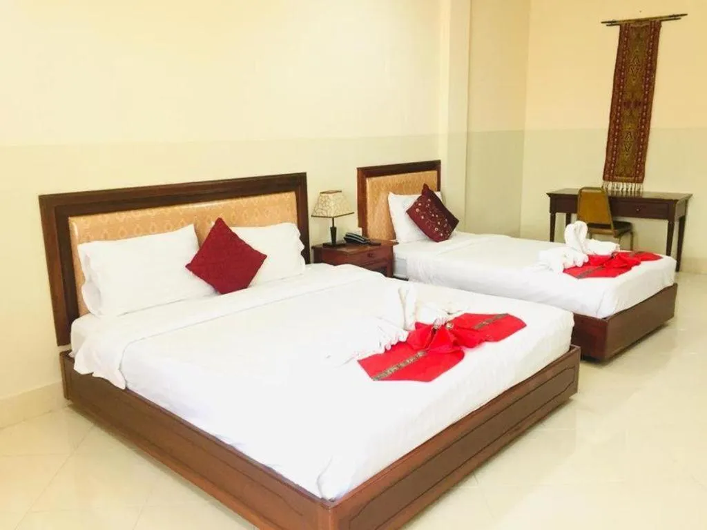 Bed in New Rose Boutique Hotel