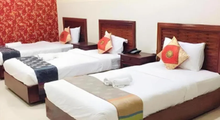 Bed in New Rose Boutique Hotel