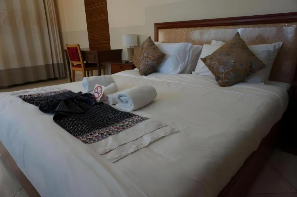 Bed in New Rose Boutique Hotel