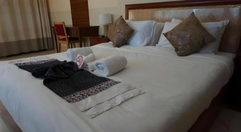 Bed in New Rose Boutique Hotel