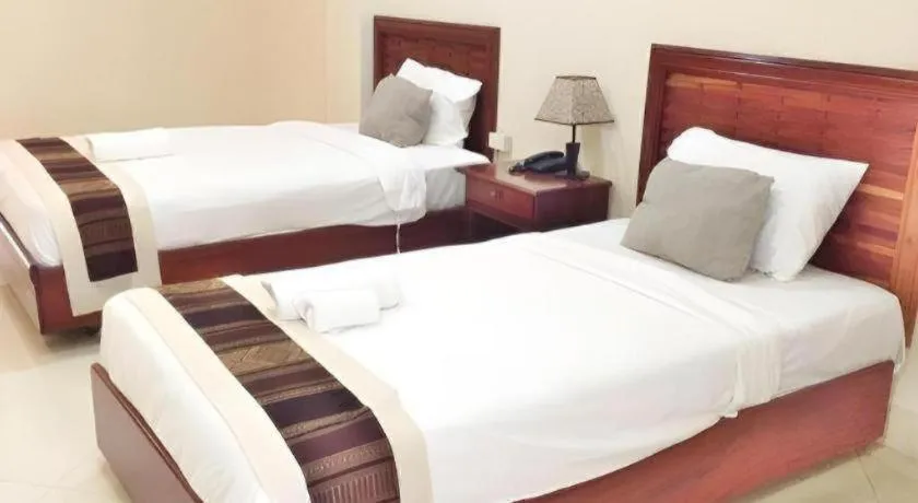 Bed in New Rose Boutique Hotel