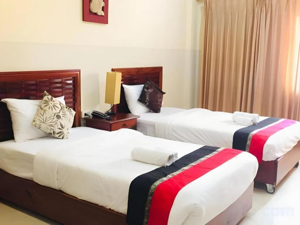 Bed in New Rose Boutique Hotel