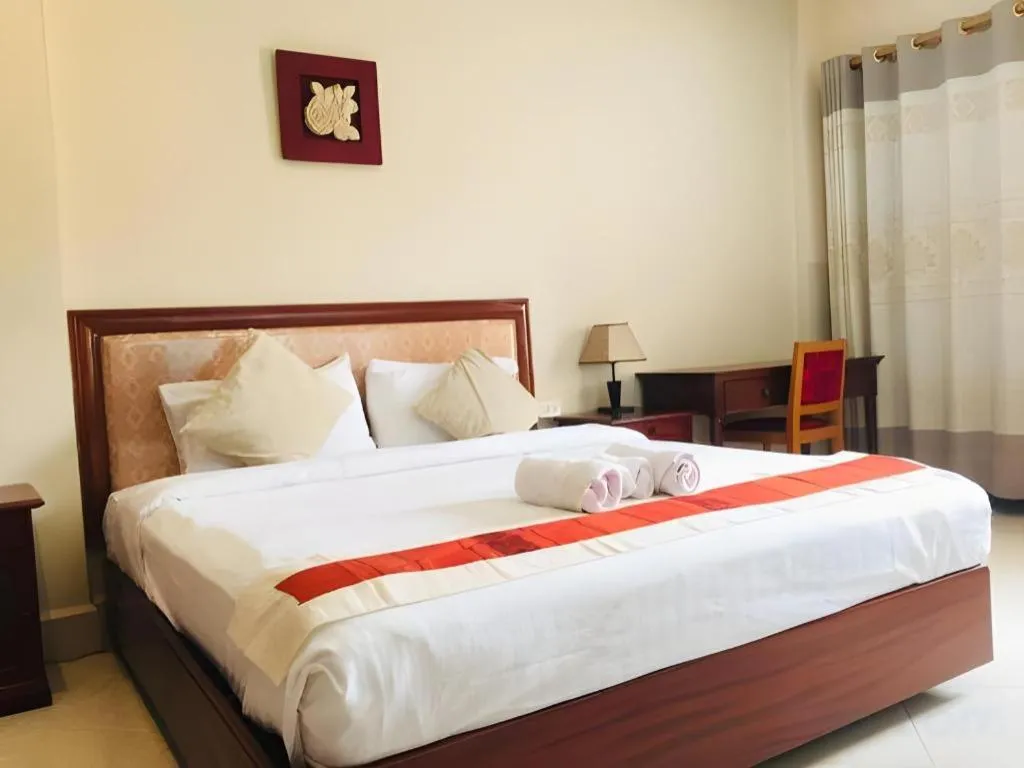 Bed in New Rose Boutique Hotel