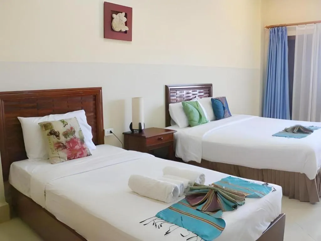 Bed in New Rose Boutique Hotel