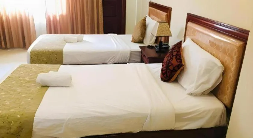 Bed in New Rose Boutique Hotel