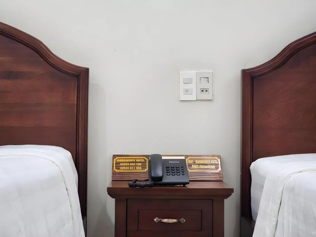 Bed in Marguerite Hotel