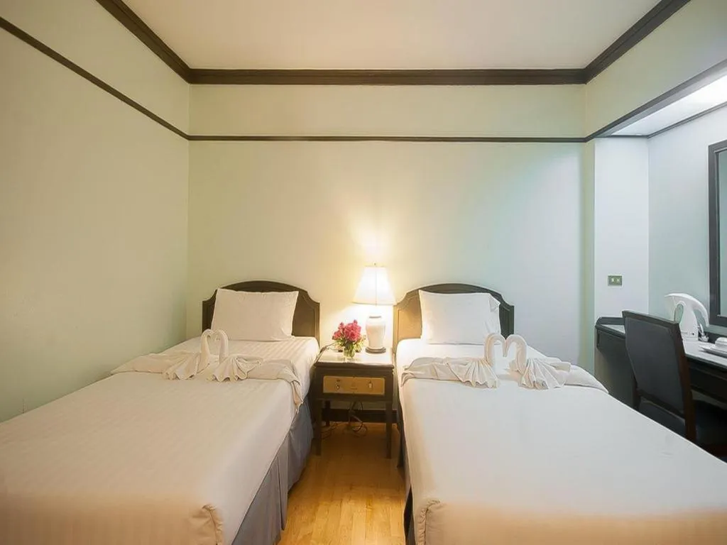 Bed in Grand Plaza Hotel