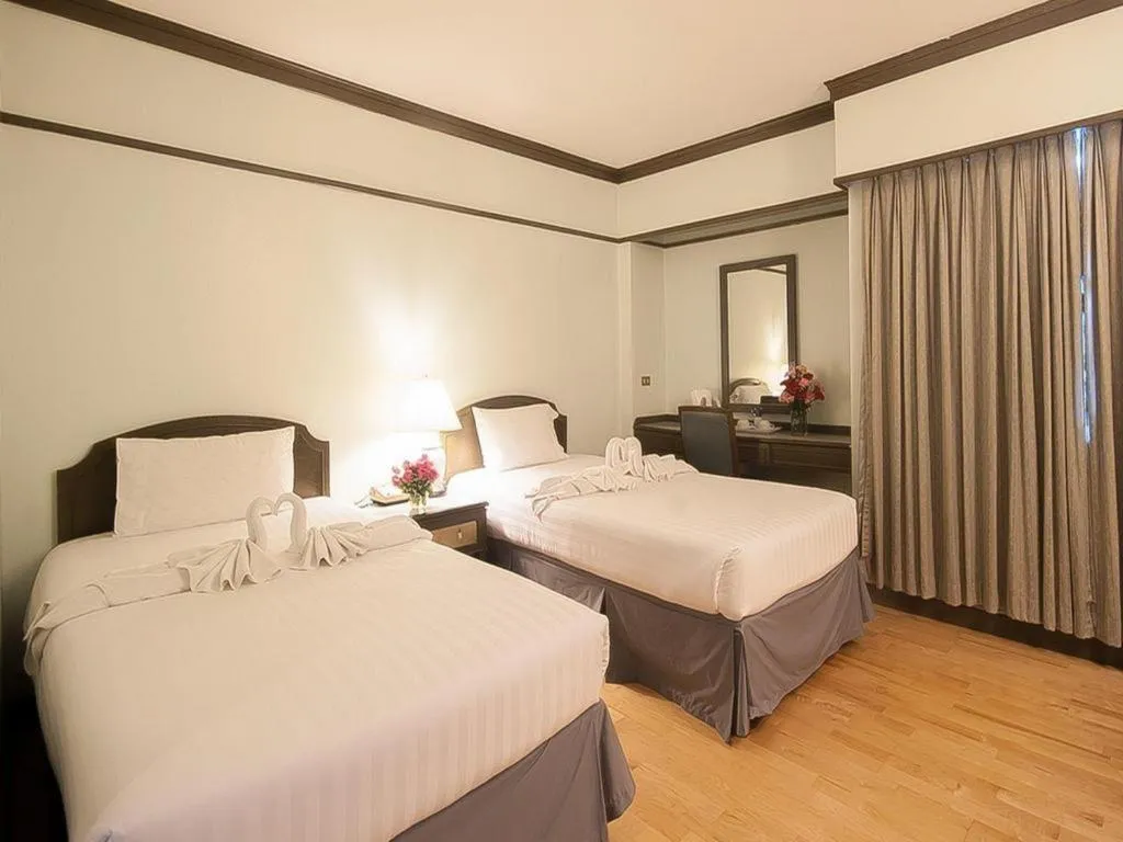 Bed in Grand Plaza Hotel