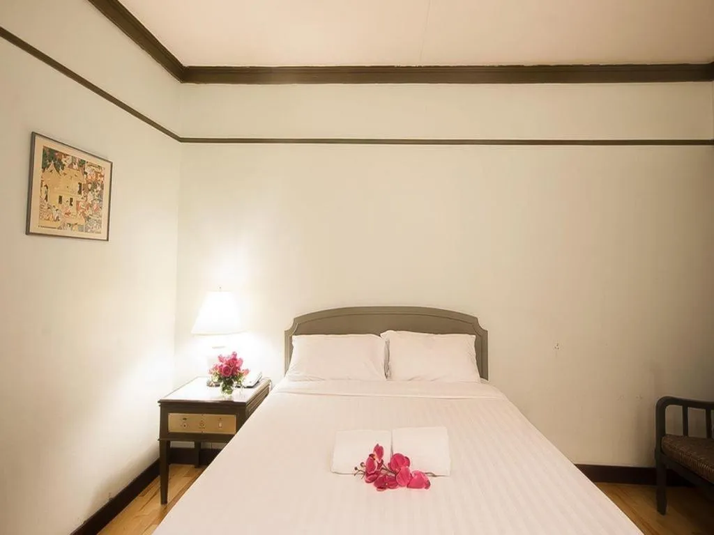 Bed in Grand Plaza Hotel