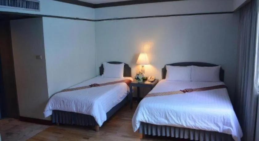 Bed in Grand Plaza Hotel