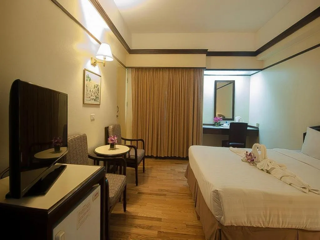 Bed in Grand Plaza Hotel