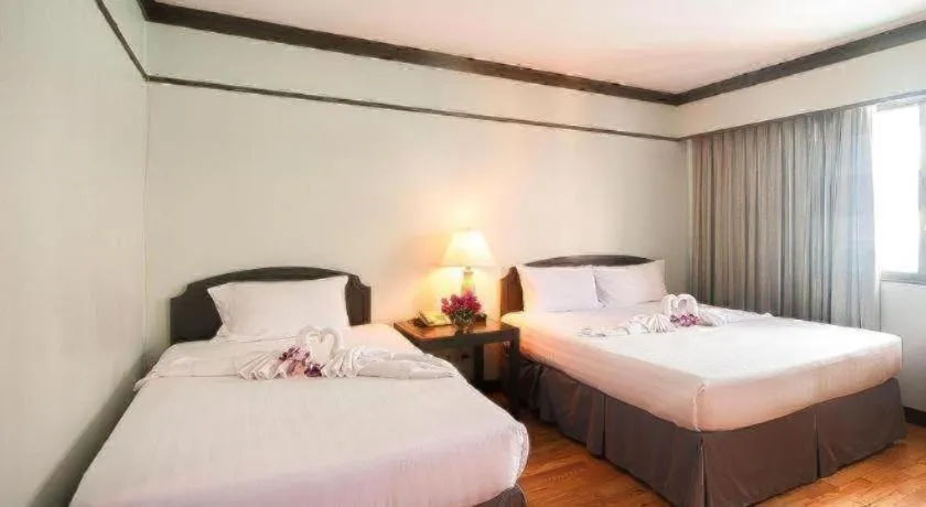 Bed in Grand Plaza Hotel