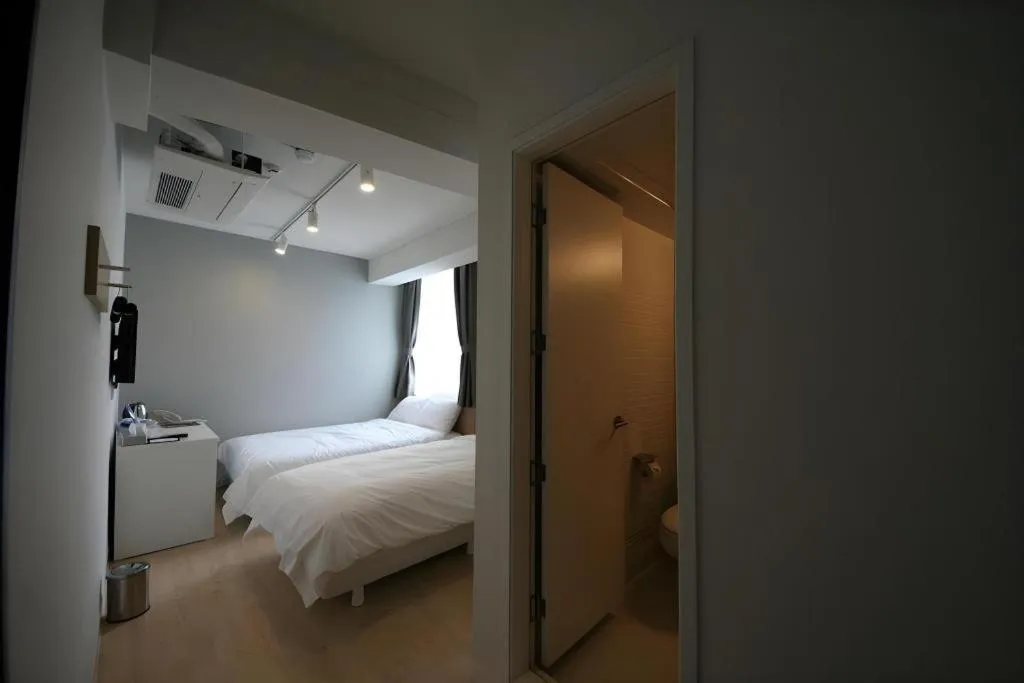 Bed in Wons Ville Myeongdong Hotel