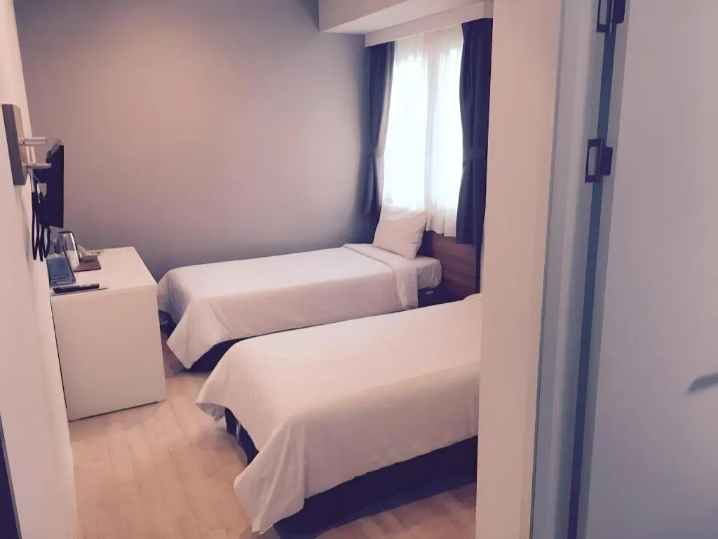 Bed in Wons Ville Myeongdong Hotel