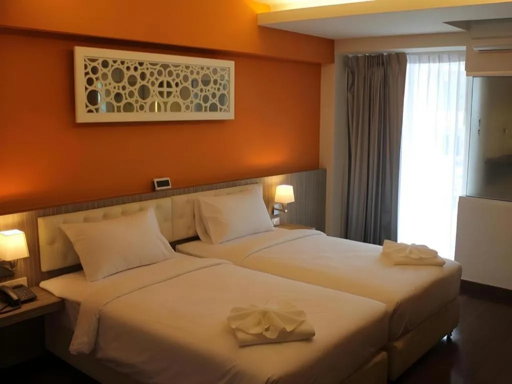 Bed in Chariot Pattaya Hotel