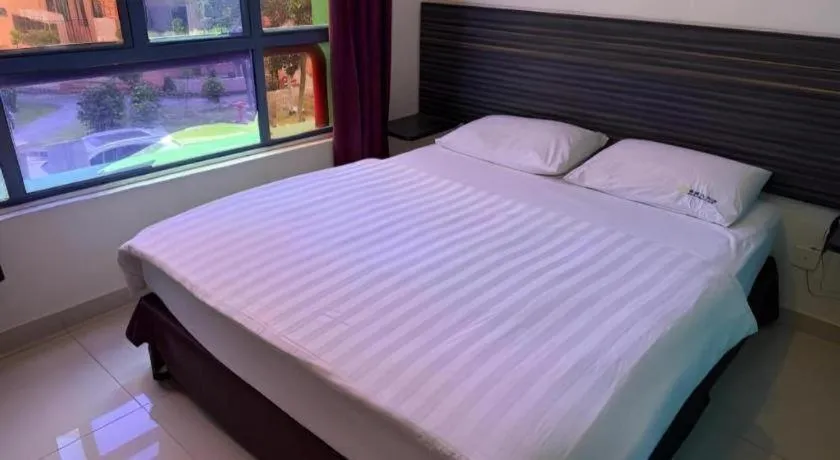 Bed in Darlene Hotel