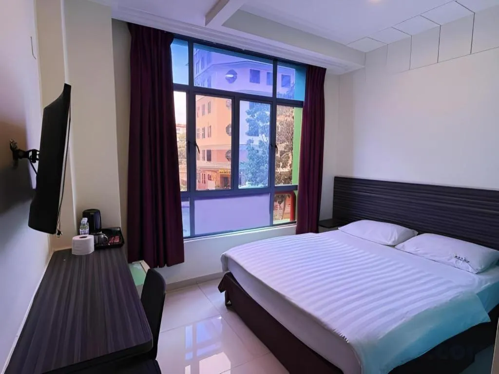 Bed in Darlene Hotel