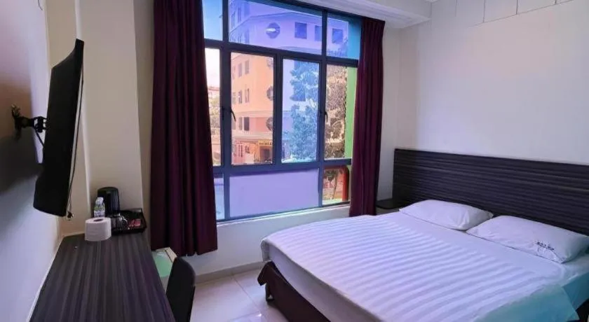 Bed in Darlene Hotel