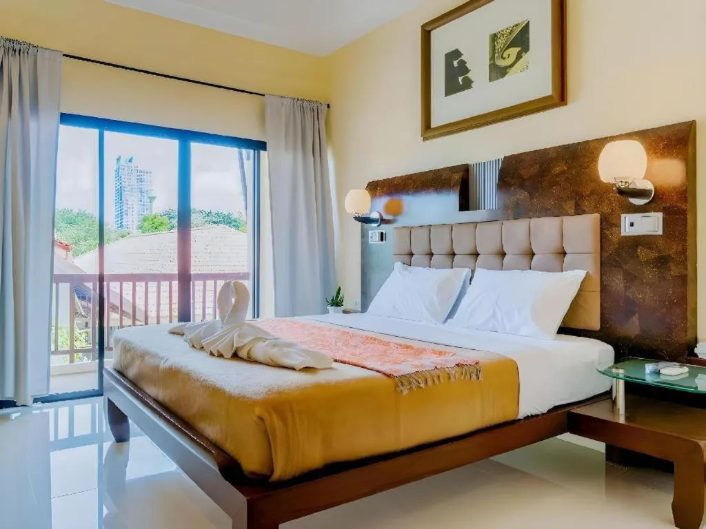 Bed in Lotusland Resort