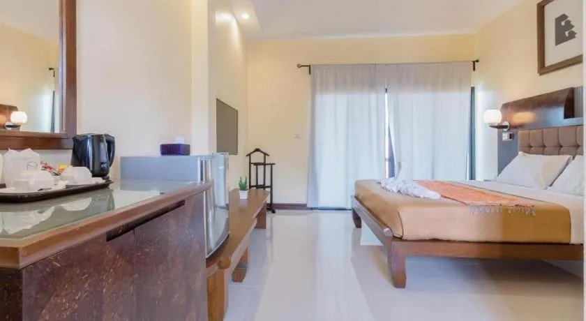 Bed in Lotusland Resort