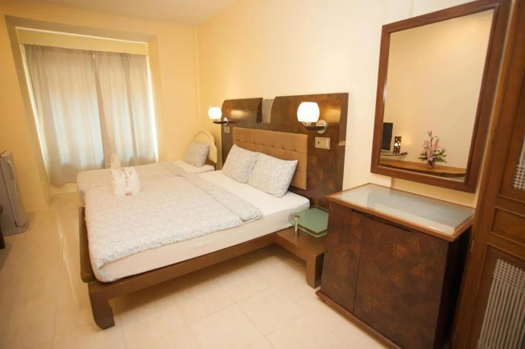 Bed in Lotusland Resort