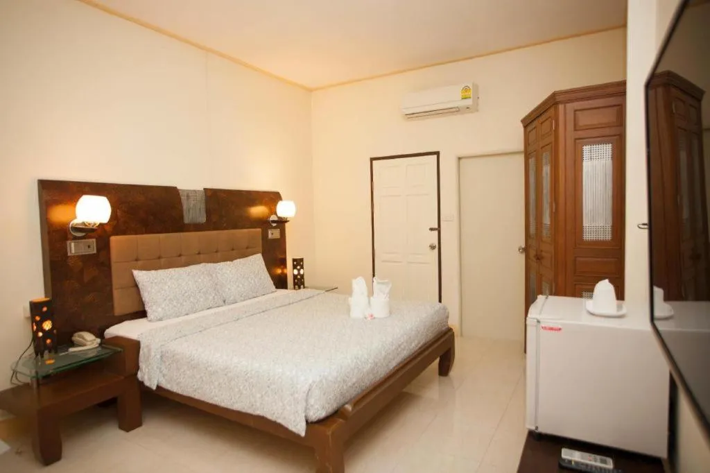 Bed in Lotusland Resort