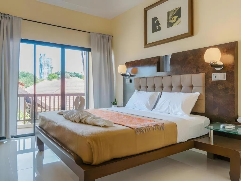 Bed in Lotusland Resort