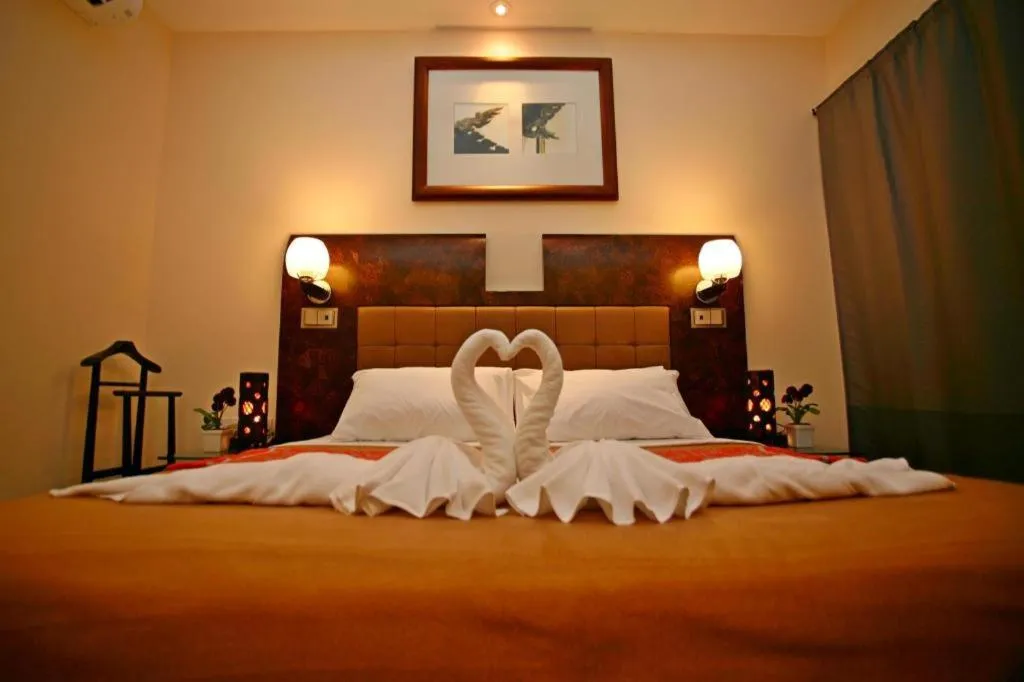 Bed in Lotusland Resort