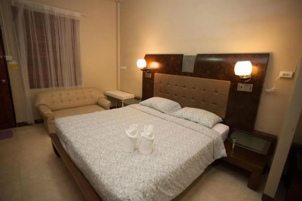 Bed in Lotusland Resort