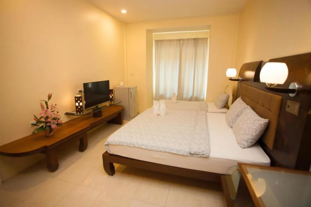 Bed in Lotusland Resort