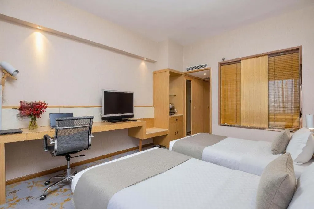 Bed in Kunming Jinjiang Hotel