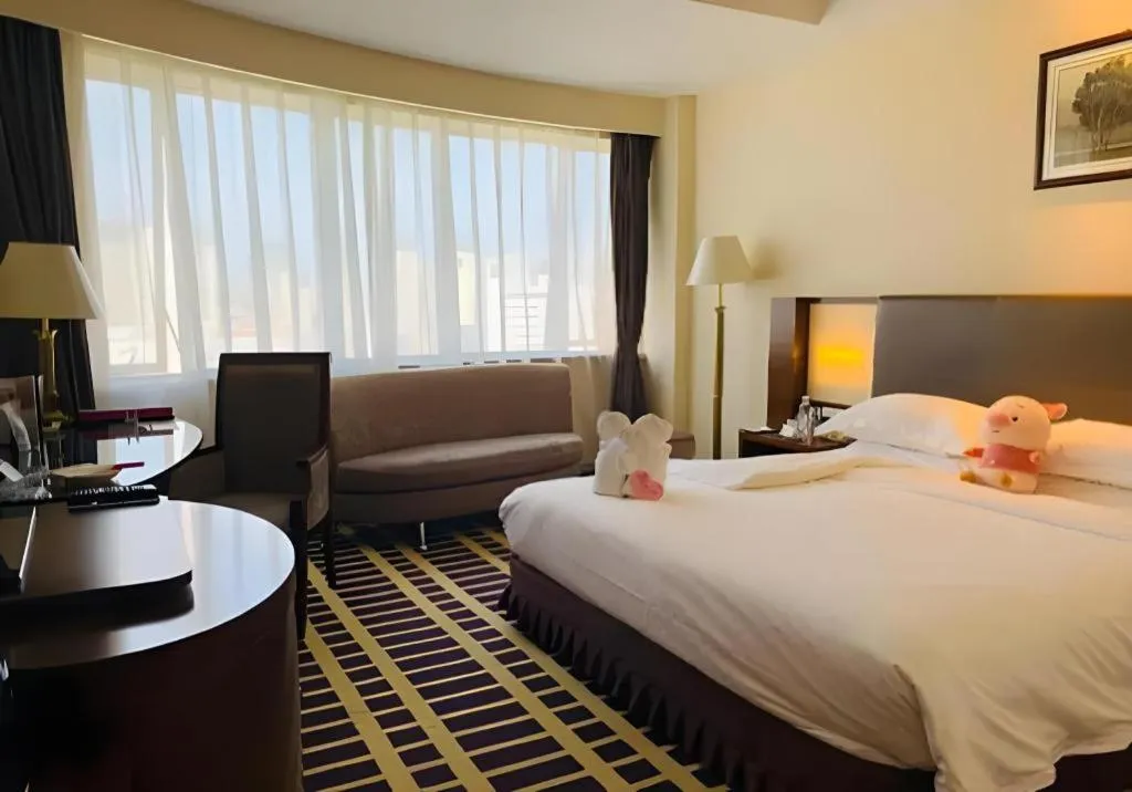 Bed in Kunming Jinjiang Hotel