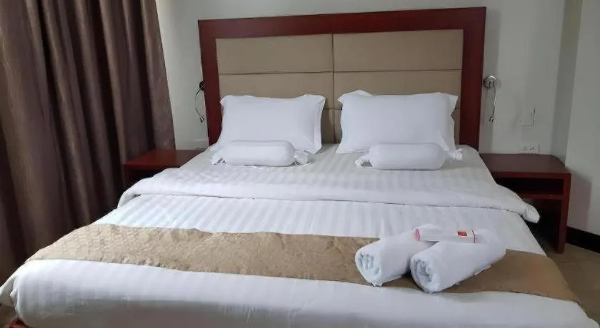 Bed in Cherry Midtown Hotel