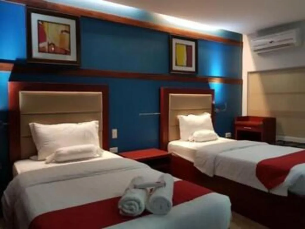 Bed in Cherry Midtown Hotel