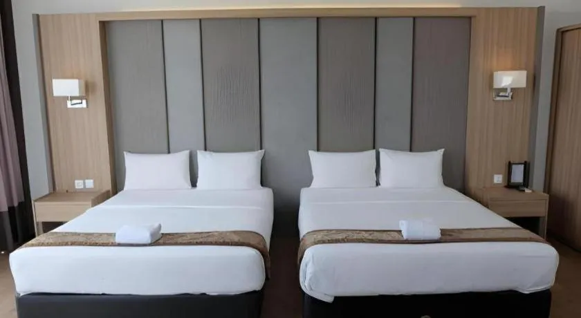 Bed in D'Season Premiere Hotel