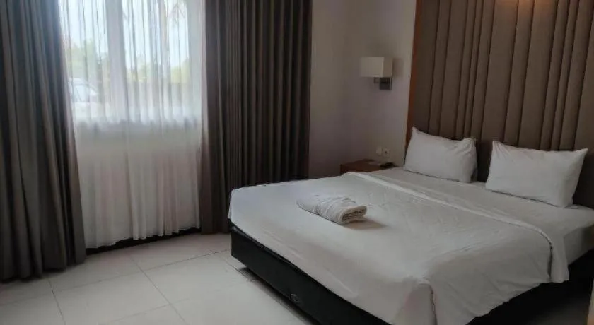 Bed in D'Season Premiere Hotel