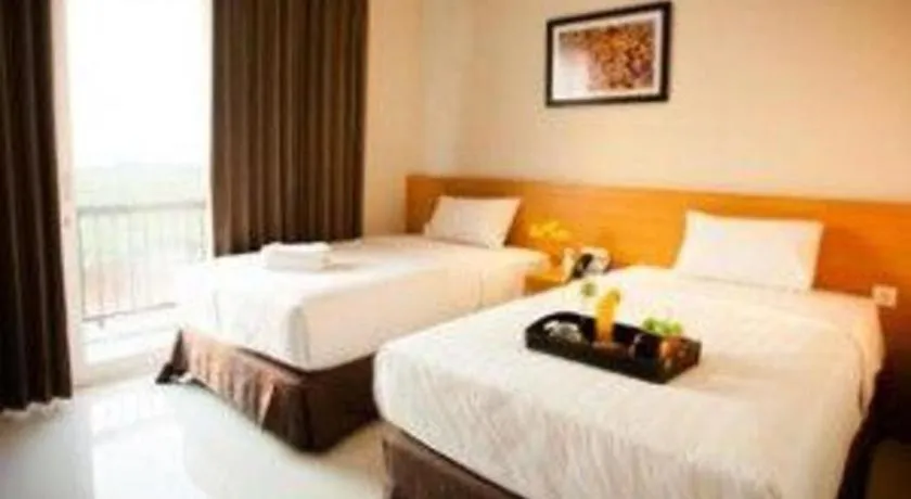 Bed in D'Season Premiere Hotel