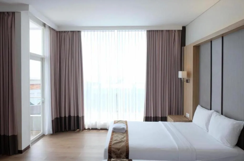 Bed in D'Season Premiere Hotel