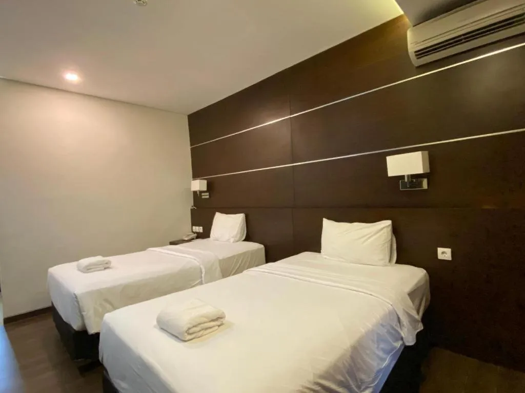 Bed in D'Season Premiere Hotel