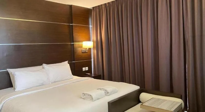 Bed in D'Season Premiere Hotel