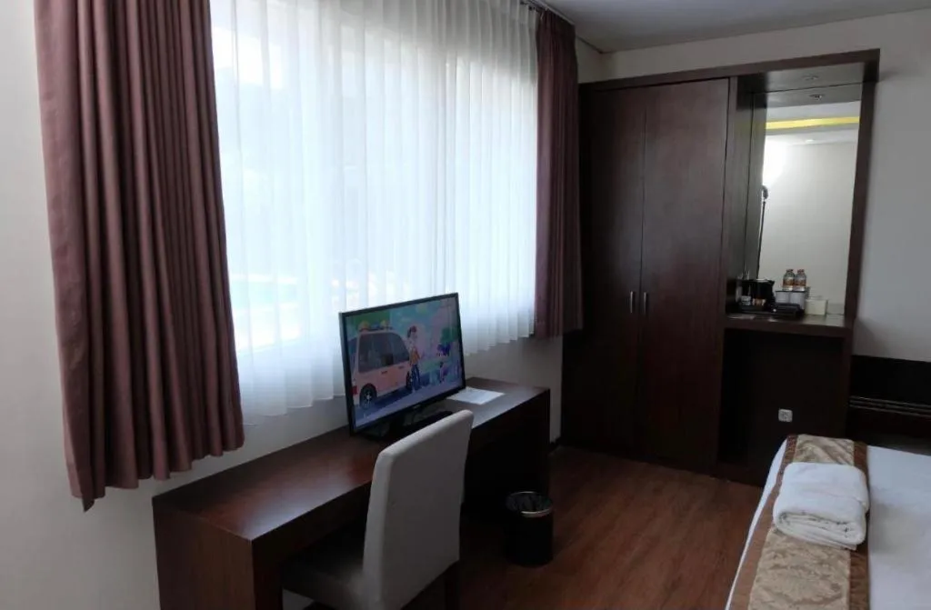 Bed in D'Season Premiere Hotel