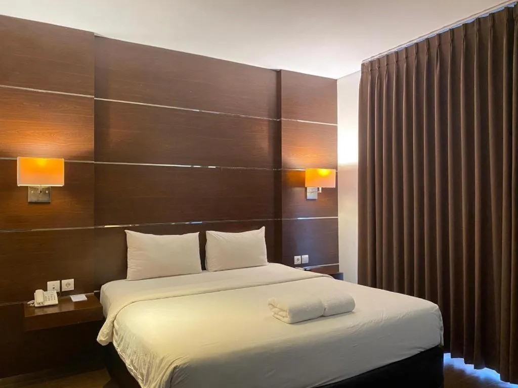 Bed in D'Season Premiere Hotel