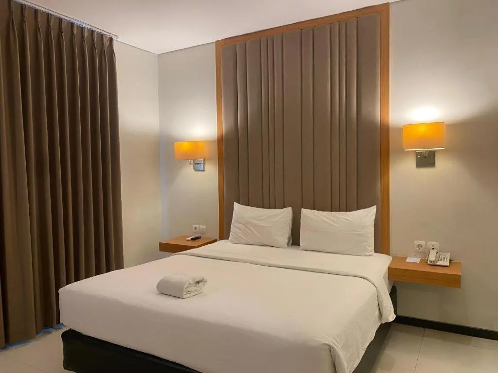 Bed in D'Season Premiere Hotel