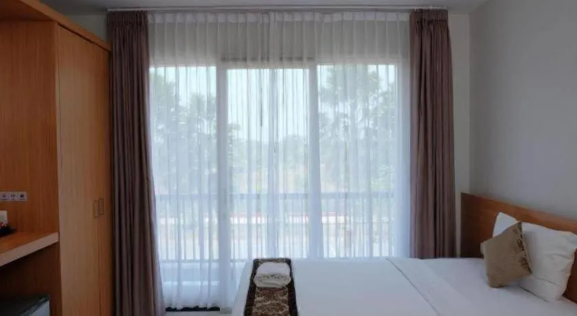 Bed in D'Season Premiere Hotel