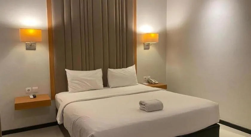 Bed in D'Season Premiere Hotel