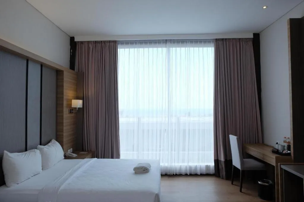 Bed in D'Season Premiere Hotel