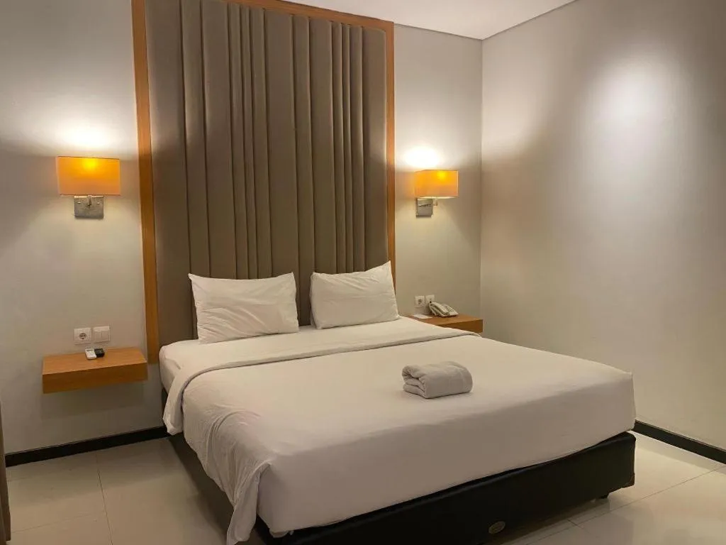 Bed in D'Season Premiere Hotel