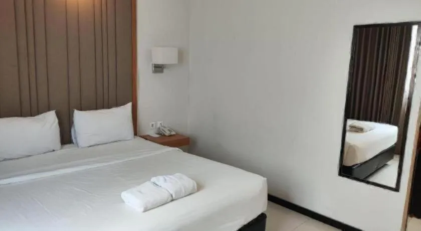 Bed in D'Season Premiere Hotel