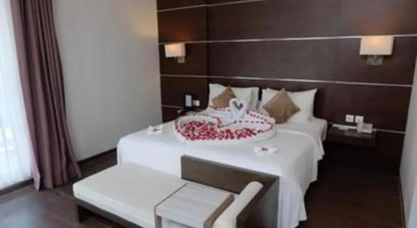 Bed in D'Season Premiere Hotel